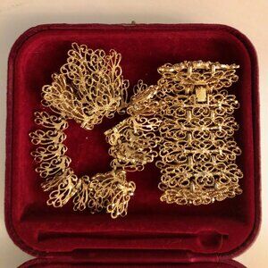 A set of vintage monet, gold colored of one necklace one bracelet, stamped Monet